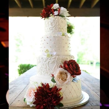 White 4 Tier Wedding cakes with red flowers