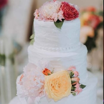 Wedding Cake With Peach and Pink Flowers